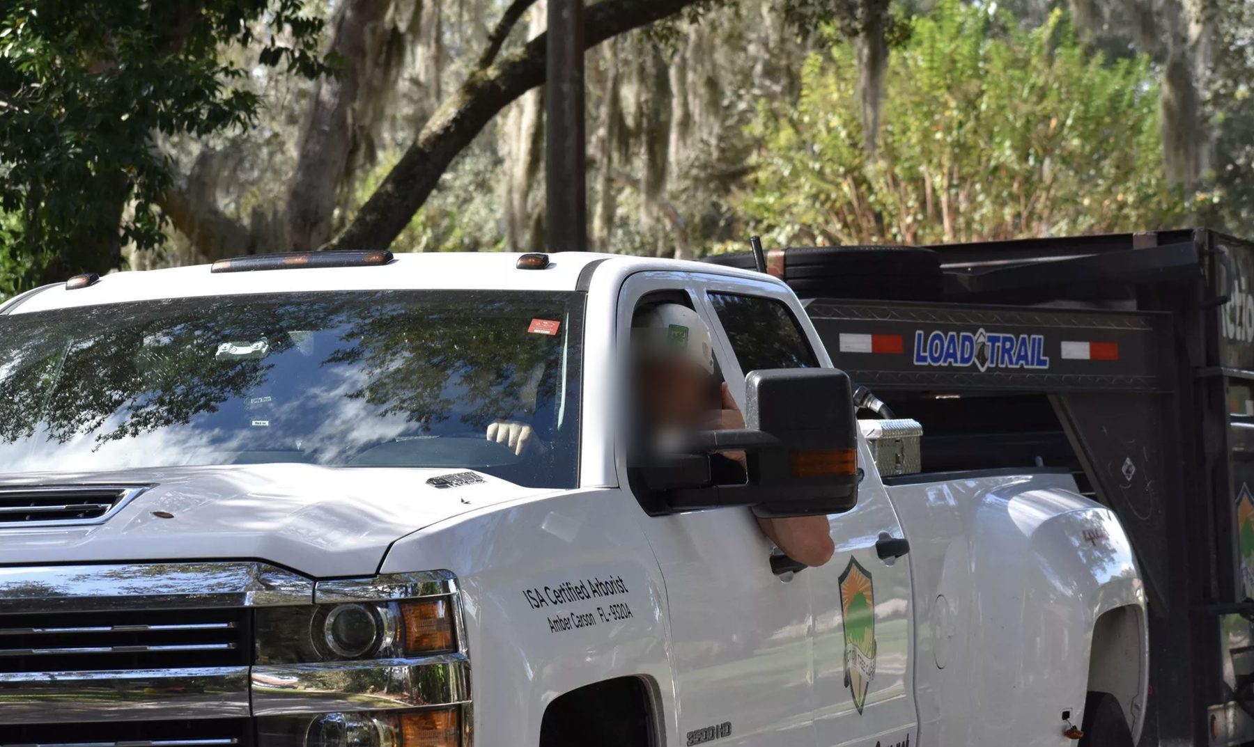 Arborist heading out to a job in the company truck